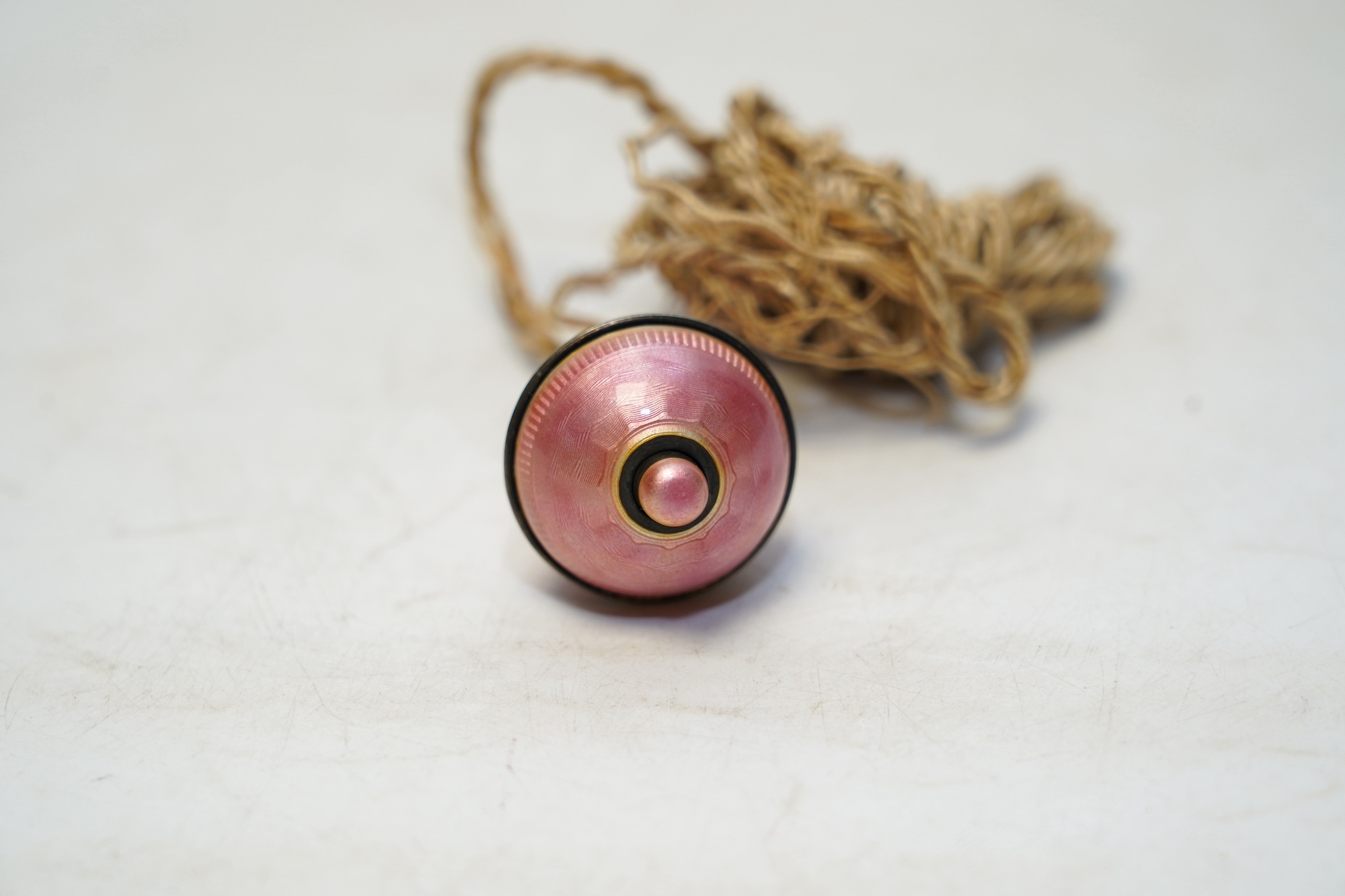 A George V silver and pink guilloche enamel bell push, London, 1919, 62mm. Condition - good